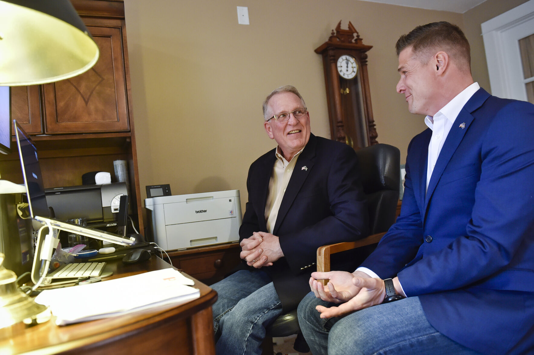 Republican candidate for governor Tim Fox, left, and his running mate Jon Knokey talk with a reporter via video conference Tuesday night at a small election night gathering at Fox's home.